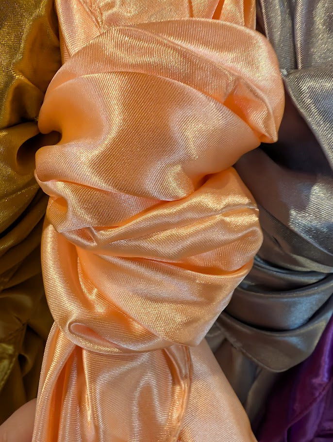 CLose up of a peach color wild rag/scarf
